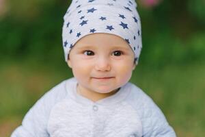 Portrait of an eight-month-old baby boy close-up face photo