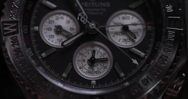 Closeup view of luxury man's wristwatch. Detail of a luxury watch on black background. Selective focus, shallow depth of field. Man's wristwatch macro video