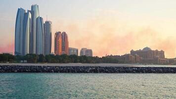 Panorama View of Abu Dhabi Skyline at sunset, United Arab Emirates. High quality 4k footage video