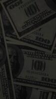 vertical dark money dollar banknote wooden desk background video