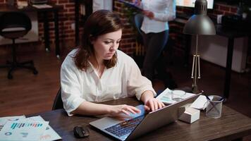 Worker creating marketing project plan on laptop, writing necessary steps, close up shot. Zoom in on office clerk working on strategy research to create financial development for company video