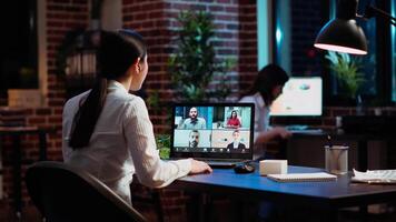 Manager organizing company meeting on videocall, discussing with employees working remotely from home. Team leader talking in corporate remote videoconference telework call with workers video