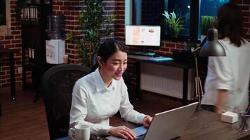 Worker greeting colleagues during business meeting on videocall in office, using online teleconference to discuss company strategy. Employee participating in remote videoconference telework call video