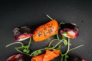 Sliced Fresh Salmon plate on black background. Salmon sashimi with black sesame, with copy space. High quality photo
