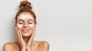 AI generated Positive young beautiful woman in white top with closed eyes applying moisturizing cream on face. High-quality crop photo of skincare and cosmetics concept with copy space for text