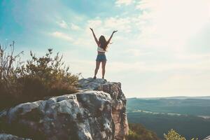 AI generated Woman Celebrates on Mountain Summit photo