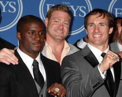 LOS ANGELES, JUL 14 - Reggie Bush, Jeremy Shockey and Drew Brees pose along with members of the New Orleans Saints after winning the ESPY for Best Team in the Press Room of the 2010 ESPY Awards at Nokia Theater, LA Live on July14, 2010 in Los Angeles, CA photo