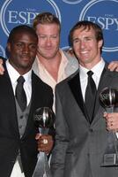 LOS ANGELES, JUL 14 - Reggie Bush, Jeremy Shockey and Drew Brees pose along with members of the New Orleans Saints after winning the ESPY for Best Team in the Press Room of the 2010 ESPY Awards at Nokia Theater, LA Live on July14, 2010 in Los Angeles, CA photo