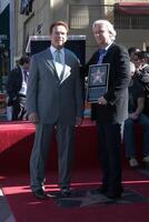 Arnold Schwarzenegger  James Cameron  at the Hollywood Walk of Fame Ceremony for James Cameron Egyptian Theater Sidewalk Los Angeles,  CA December 18, 2009 photo