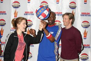 Rachel Kimsey Jack Wagner Globetrotter helping Rachel to spin a ball Harlem Globetrotters Game Staples Center Los Angeles, CA February 20, 2006 photo