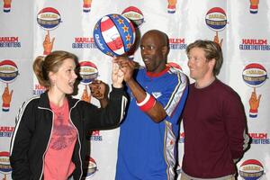 Rachel Kimsey Jack Wagner Globetrotter helping Rachel to spin a ball Harlem Globetrotters Game Staples Center Los Angeles, CA February 20, 2006 photo