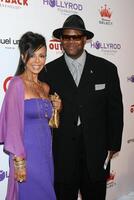 Jimmy Jam   wife   arriving at the 10th Annual Designcare Fundraiser benefiting the HollyRod Foundation at a private residence in Malibu, CA on July 19, 2008 photo
