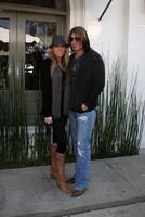 Tish  Billy Ray Cyrus arriving at the 7th Annual John Varvatos Stuart House Benefit at the John Varvatos Store in West Hollywood, CA  on March 8, 2009 photo