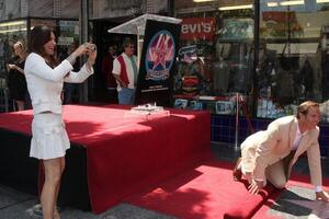 Roma Downey  Mark Burnett at the Mark Burnett Star on the  Hollywood Walk of Fame Ceremony  in Hollywood, CA on July 8, 2009 photo