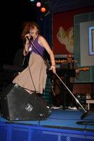 Lucy Lawless performs at Universal CityWalk's Summer Block Party in Universal City, CA on June 28, 2008 photo