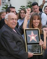 Johnny Grant, Honorary Mayor of Hollywood, and Hilary Swank Hilary Swank receives a star on the Hollywood Walk of Fame in front of Grauman's Chinese Theater Los Angeles,  CA January 8, 2007 photo