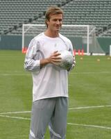 David Beckham demonstrates soccer skills for children after press conference to announce Soccer Academy beginning in Fall 2005 at the Home Depot Center in So California. Carson, CA June 2, 2005 photo