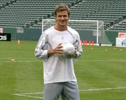 David Beckham demonstrates soccer skills for children after press conference to announce Soccer Academy beginning in Fall 2005 at the Home Depot Center in So California. Carson, CA June 2, 2005 photo