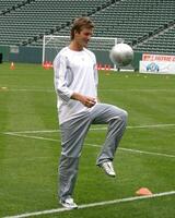 David Beckham demonstrates soccer skills for children after press conference to announce Soccer Academy beginning in Fall 2005 at the Home Depot Center in So California. Carson, CA June 2, 2005 photo