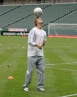 David Beckham demonstrates soccer skills for children after press conference to announce Soccer Academy beginning in Fall 2005 at the Home Depot Center in So California. Carson, CA June 2, 2005 photo