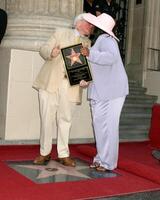 Roger ebert y esposa Roger ebert recibe estrella en caminar de fama hollywood caminar de fama los ángeles, California junio 23, 2005 foto