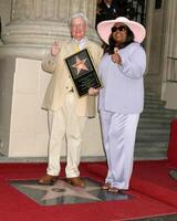 Roger Ebert and wife Roger Ebert Receives Star on Walk of Fame Hollywood Walk of Fame Los Angeles, CA June 23, 2005 photo