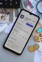 TERNOPIL, UKRAINE - AUGUST 3, 2023 Credit Agricole application on screen on modern smartphone. Official app of famous polish bank photo