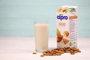 KHARKIV, UKRAINE - JANUARY 2, 2021 Alpro almond vegetarian milk pack produced by European company based in Wevelgem photo