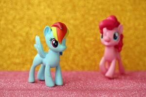 TERNOPIL, UKRAINE - JULY 7, 2023 Old toy with character from My Little Pony MLP cartoon TV show on bright shiny glitter background photo