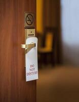 do not disturb sign hanging photo