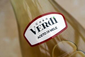 KYIV, UKRAINE - OCTOBER 31, 2023 Casa Verdi Aceto di Mele olive oil bottle with apple flavour photo