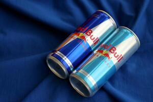 TERNOPIL, UKRAINE - JULY 7, 2023 Red Bull energy drink aluminium tin can with original design photo