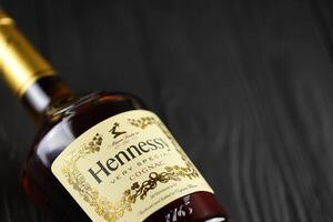 KYIV, UKRAINE - MAY 4, 2022 Hennessy Very Special original alcohol bottle on black wooden table photo