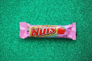 KYIV, UKRAINE - MAY 4, 2022 Nuts original chocolate bar manufactured by Nestle company photo