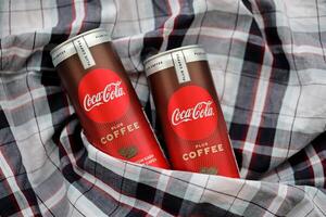 KYIV, UKRAINE - OCTOBER 31, 2023 Can of Coca Cola with coffee flavor. Closed tin can of drink with special design photo