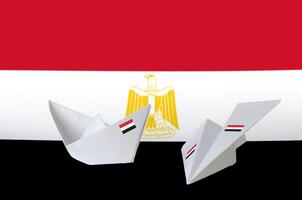 Egypt flag depicted on paper origami airplane and boat. Handmade arts concept photo