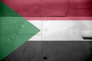 Sudan flag depicted on side part of military armored helicopter closeup. Army forces aircraft conceptual background photo