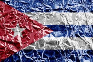 Cuba flag depicted in paint colors on shiny crumpled aluminium foil closeup. Textured banner on rough background photo