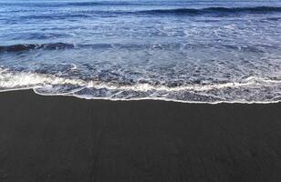 Black sand beach photo