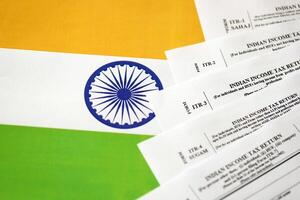 Indian income tax return blank forms on indian country flag photo