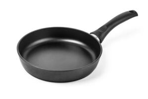 black frying pan isolated on white background photo