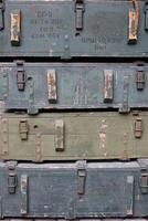 Soviet army ammunition stack of green crates with russian names of ammo type and category photo