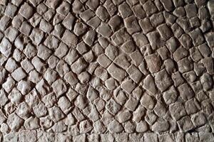 pavimentación Roca pavimento antecedentes textura. guijarro pavimentar parte superior ver de antiguo pedregoso acera foto