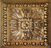 Elegant dark brown ceiling with stone patterns and a rosette texture photo