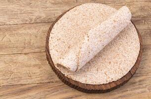 tortilla  on wooden table photo