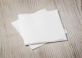 white paper napkin on  table photo