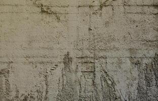 Texture of the old embossed concrete wall in gray color. Background image of a concrete product photo