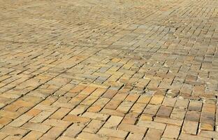 Photo of the site of a long and old worn paving slab