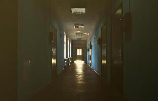 The gloomy corridor of a neglected public building. Public space in a poor residential high-rise building photo