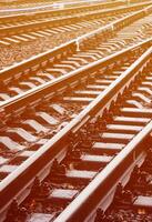 Photo fragment of the railroad tracks in the rainy weather